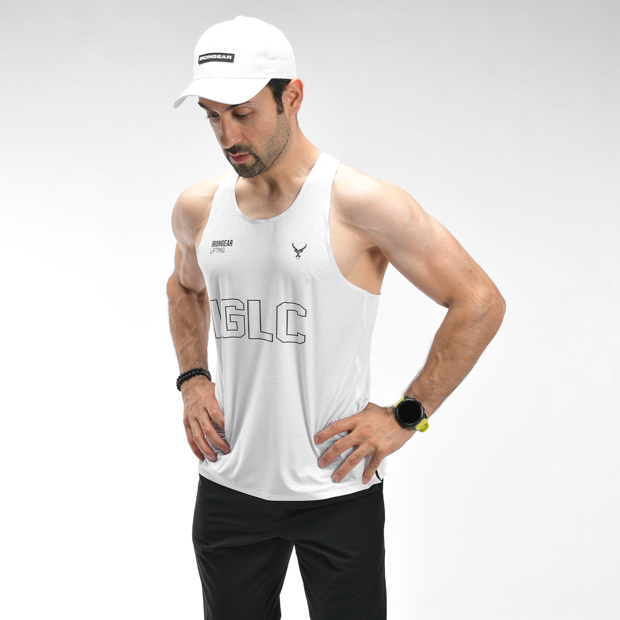 Man wearing a white tank top with 'MAGIC' branding on a gray background