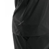 Close-up of a black garment with a tape on a white background. 